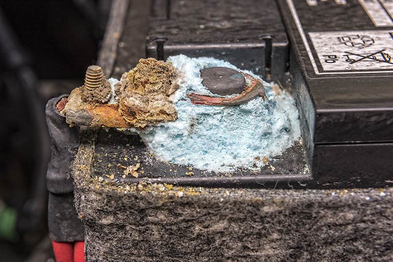 Heavy corrosion on the terminal of a lead-acid battery