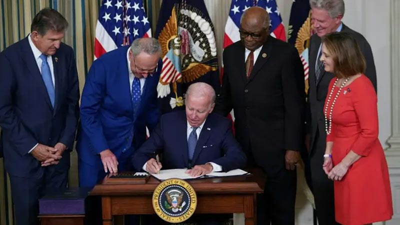President Joe Biden signing the Inflation Reduction Act into law