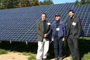 Clay, Lee and Mike of Revolution Energy in front of solar panels supplied by altE for the 100 kilowatt array at Exeter High School.